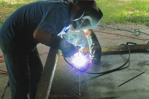 Machinery Shed welding with goggles